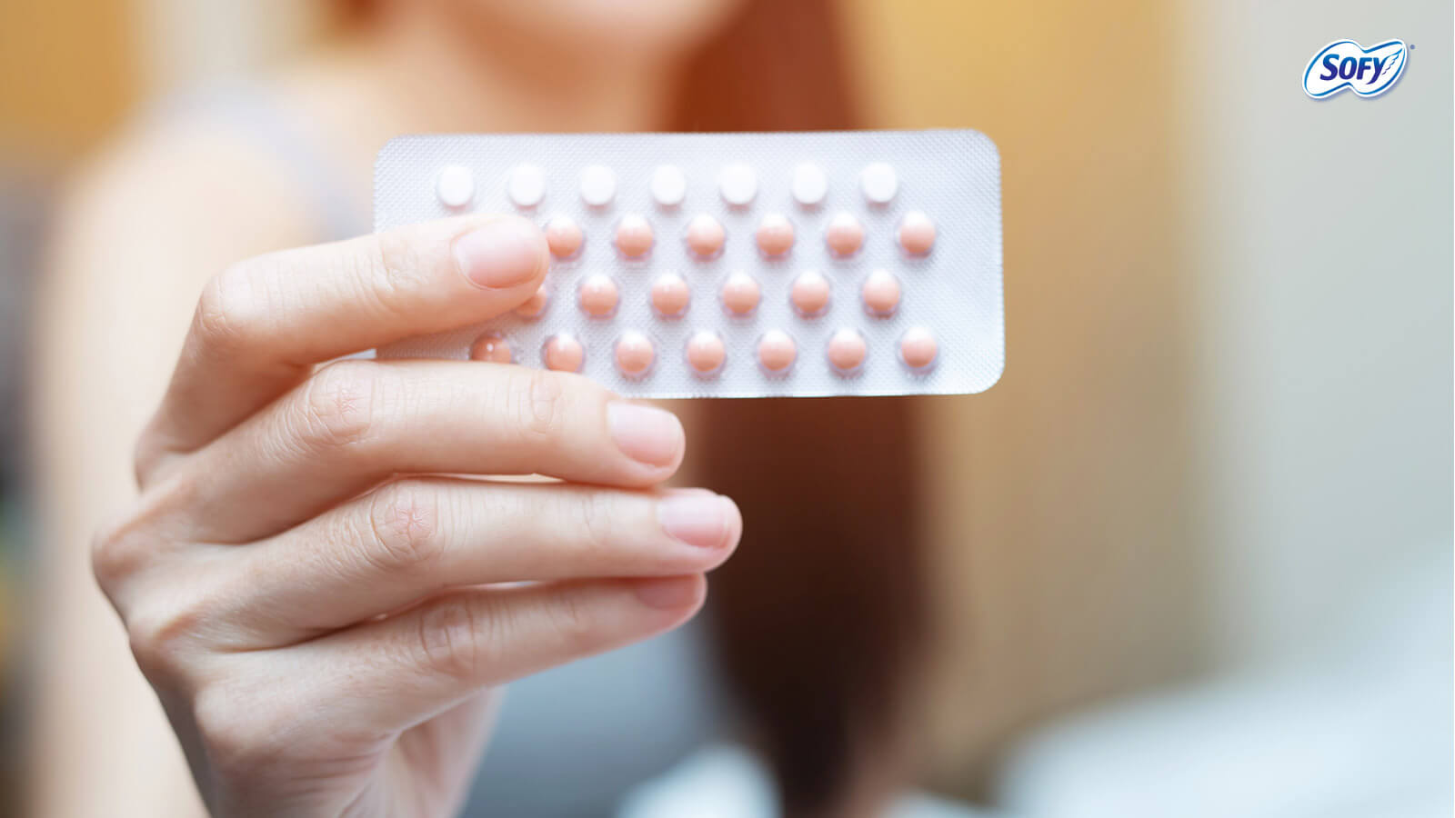 woman eating birth control pills